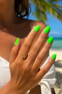 1. Electric Neon Green July Vacation Nail Designs