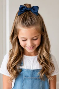 1. Bow-Tied Half-Up Ponytail Easy Back-to-School Hairstyles for Girls