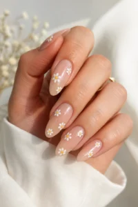 13. White Daisy Nail Art With Nude Base
