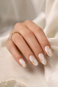 25. White Nails With Gold Foil Accents