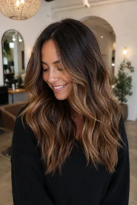 26. Lived-In Caramel Balayage With Natural Roots