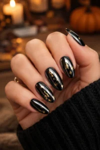 6. Black Chrome Nails With Gold Flakes