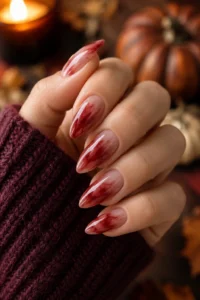 8. Deep Red Aura Swirl Nails